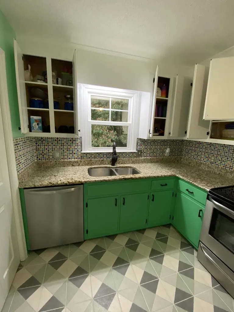 Kitchen cabinets painted green with new finish