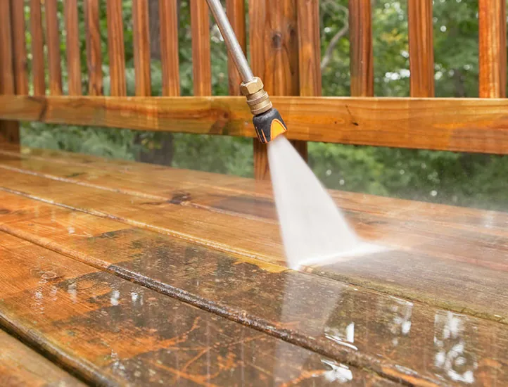 Pressure washing a wood deck